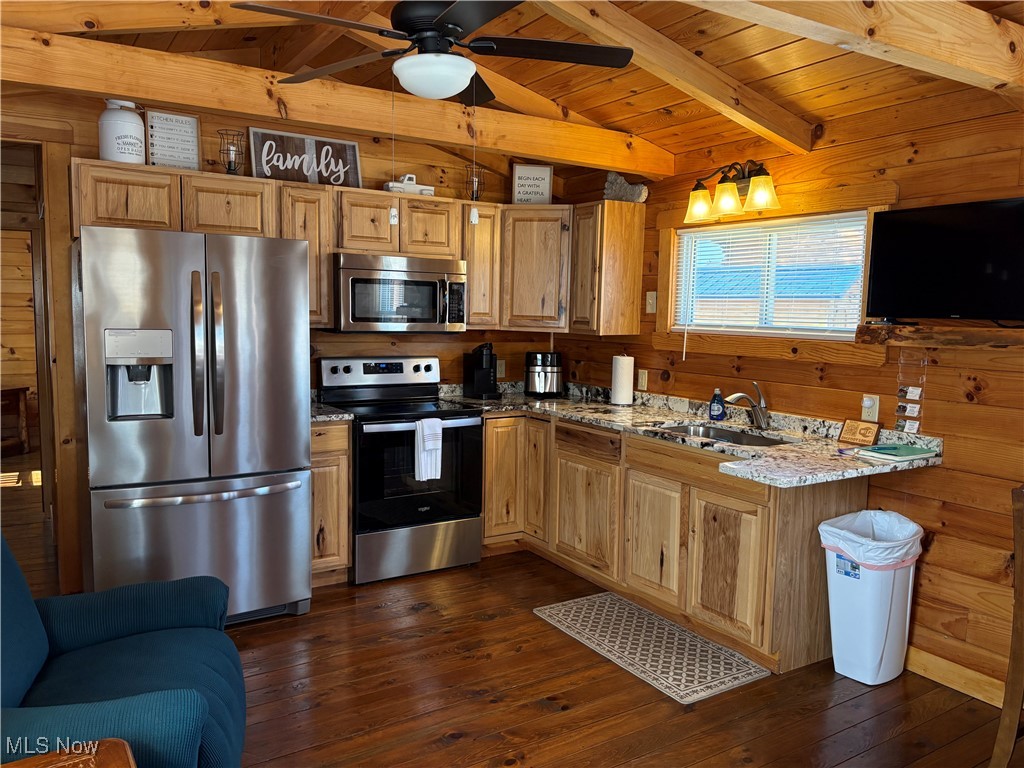 5919 Lake Road West, Unit 18 Ashtabula, OH 44004 - Photo 18 of 32 Kitchen with wood walls, stainless steel appliances, dark wood-type flooring, wood ceiling, and a ceiling fan