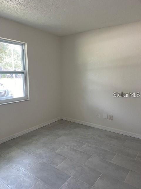 3145 Huron Avenue, Unit A Oldsmar, FL 34677 - Photo 10 of 10 an empty room with a window