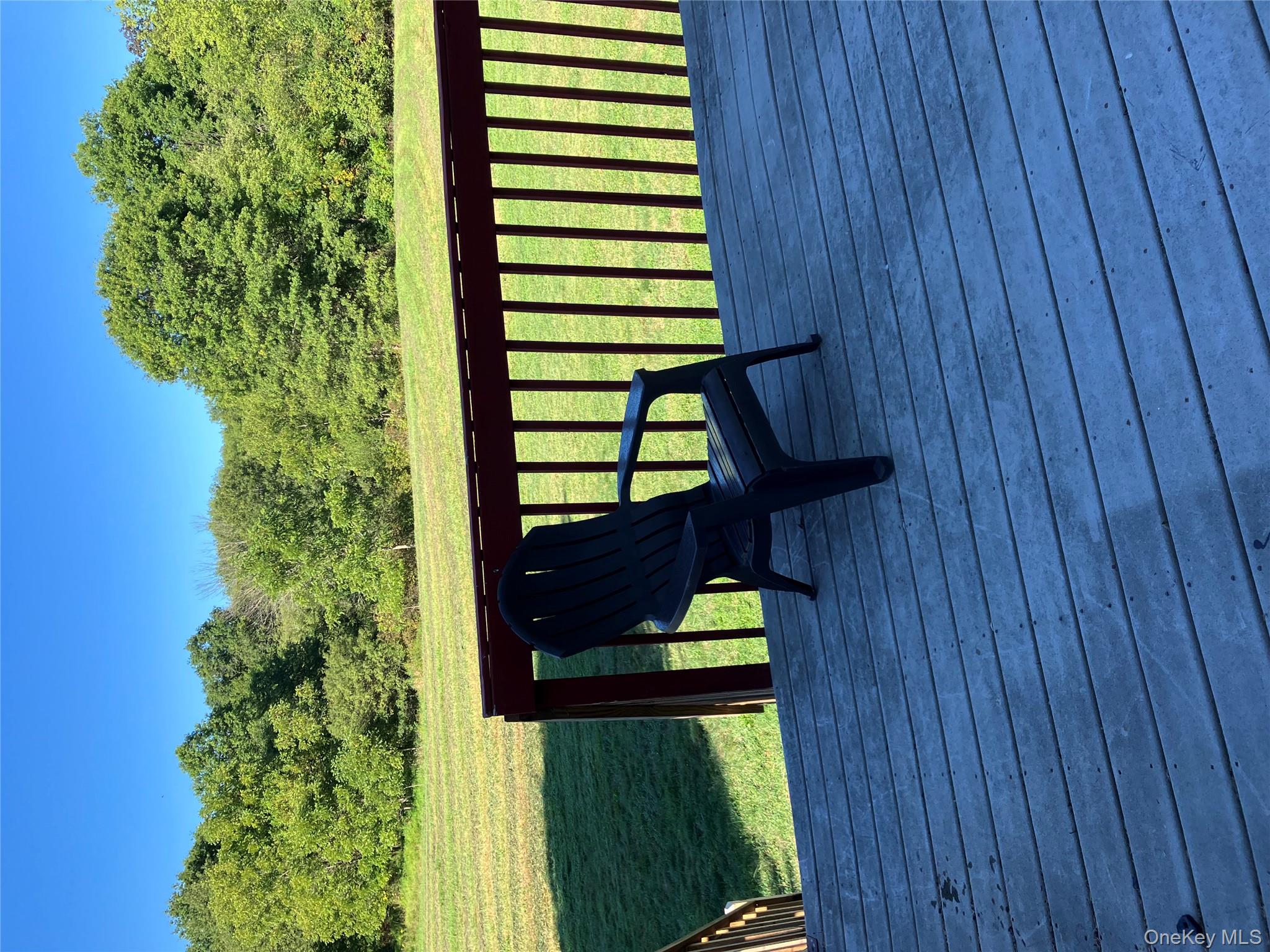 133 Ridgebury Road New Hampton, NY 10958 - Photo 12 of 14 Wooden deck with a lawn and a view of trees