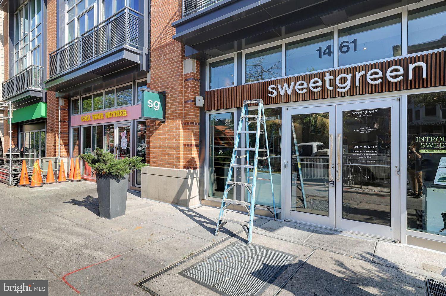 1133 14th Street Northwest, Unit 306 Washington, DC 20005 - Photo 32 of 36 a view of a building with retail shops
