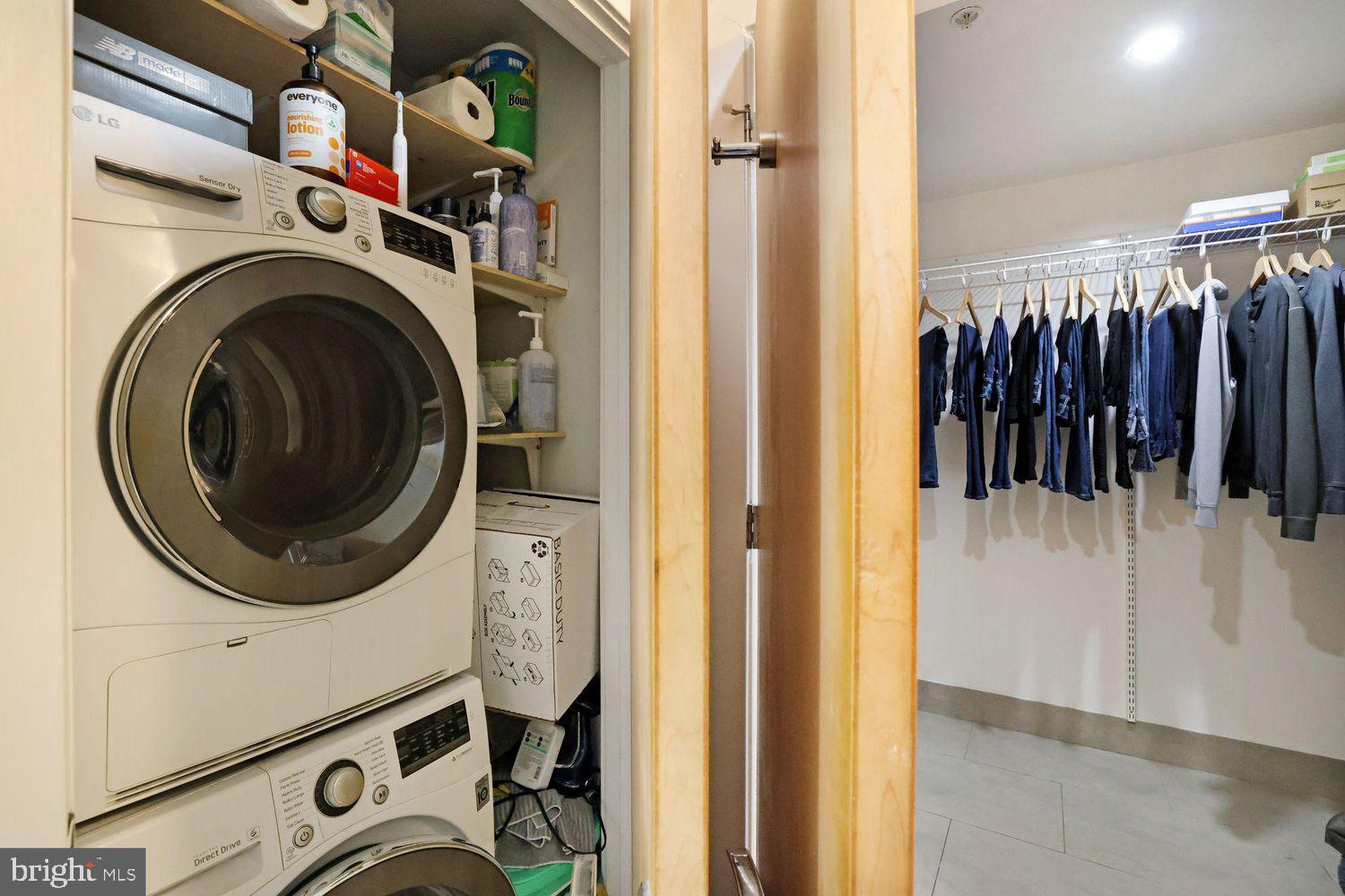 1133 14th Street Northwest, Unit 306 Washington, DC 20005 - Photo 10 of 36 a utility room with dryer washer and a view of living room