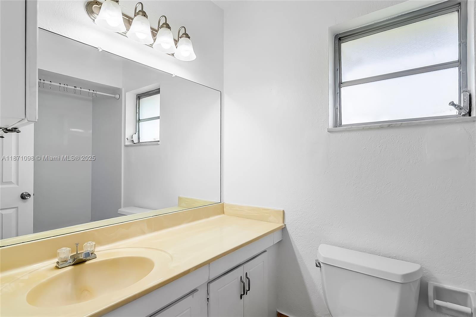 2500 Southwest 81st Avenue, Unit 402 Davie, FL 33324 - Photo 11 of 51 a bathroom with a sink and a mirror