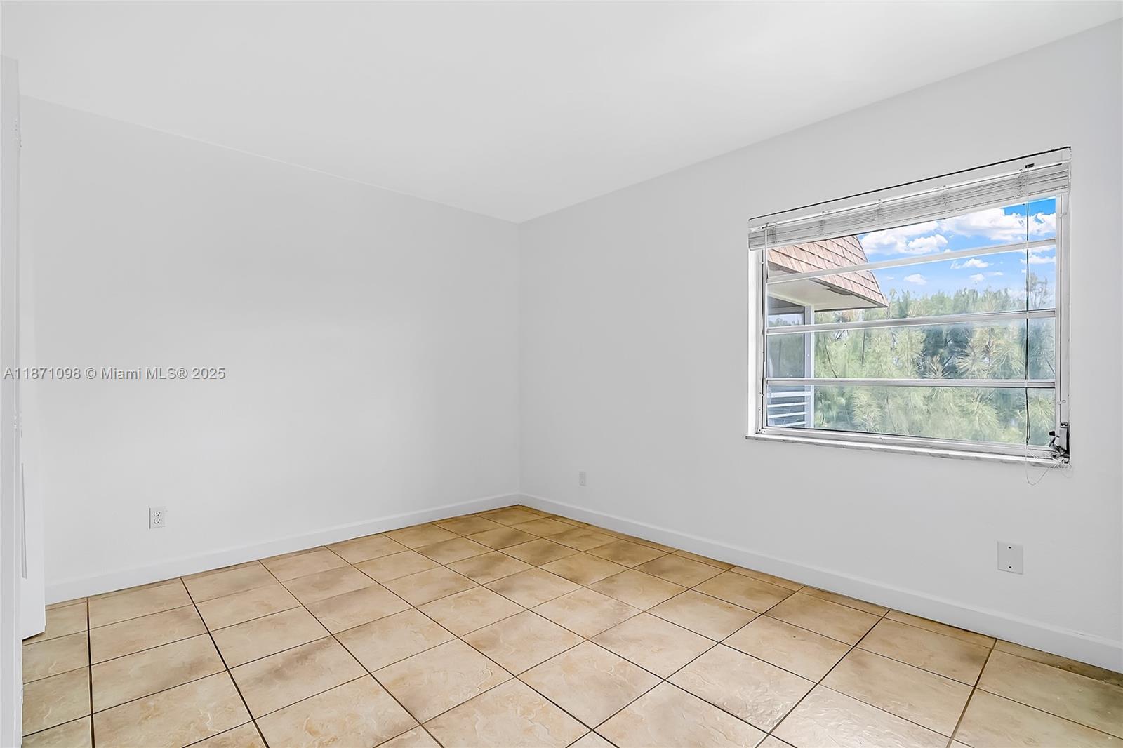 2500 Southwest 81st Avenue, Unit 402 Davie, FL 33324 - Photo 14 of 51 a view of a small space with wooden floor and a window