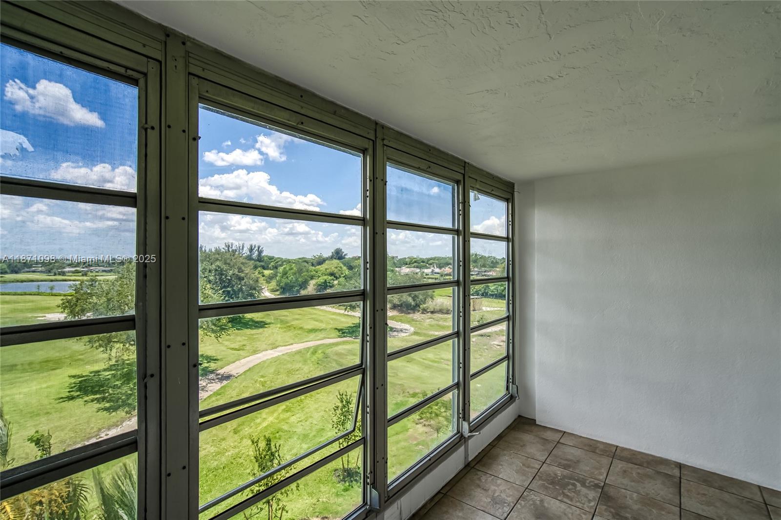 2500 Southwest 81st Avenue, Unit 402 Davie, FL 33324 - Photo 22 of 51 a view of a glass door with a balcony from a window