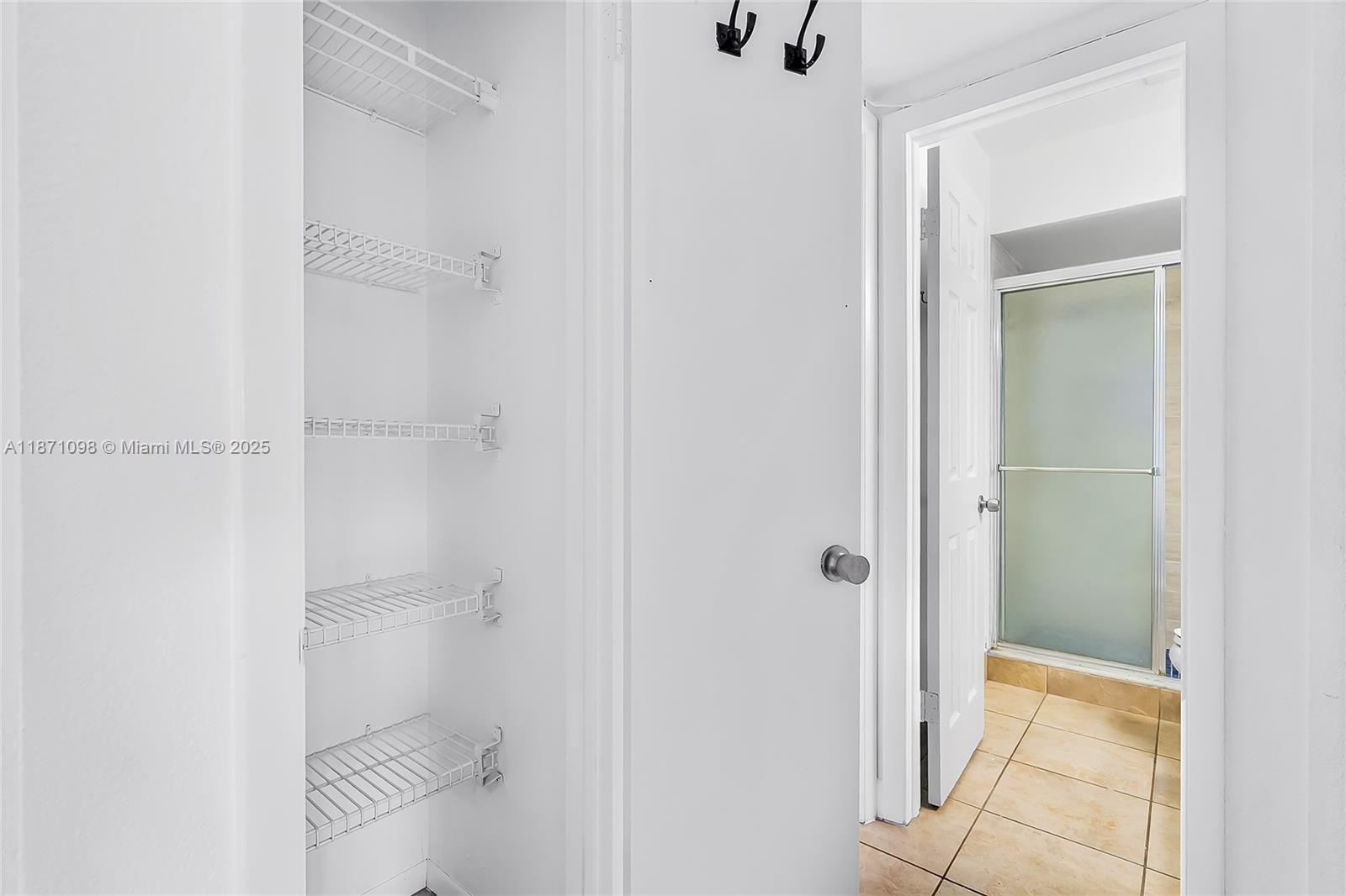 2500 Southwest 81st Avenue, Unit 402 Davie, FL 33324 - Photo 28 of 51 a bathroom with a shower and toilet