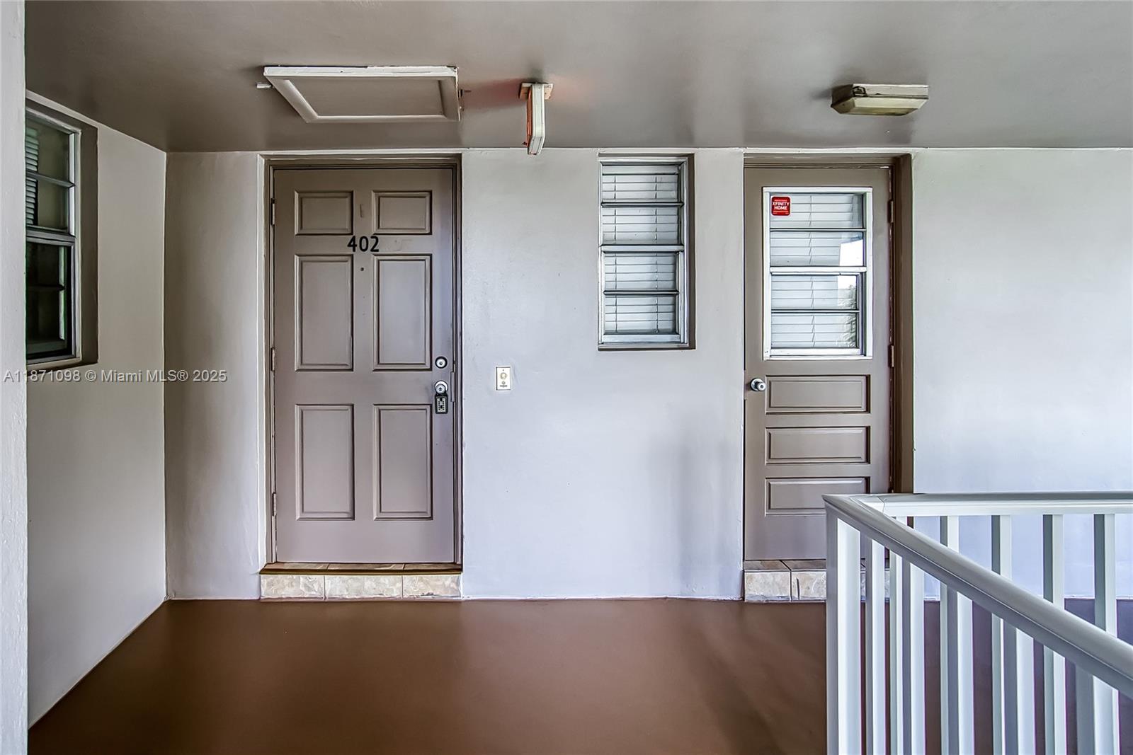 2500 Southwest 81st Avenue, Unit 402 Davie, FL 33324 - Photo 29 of 51 a view of an empty room with wooden floor and a window