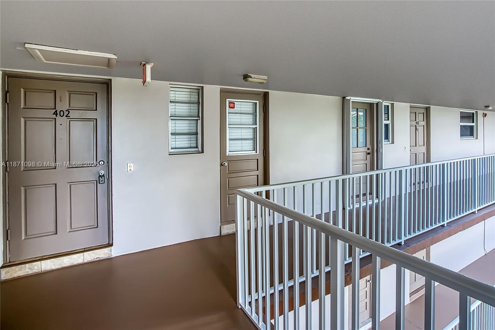 2500 Southwest 81st Avenue, Unit 402 Davie, FL 33324 - Photo 30 of 51 a view of staircase with rug floor