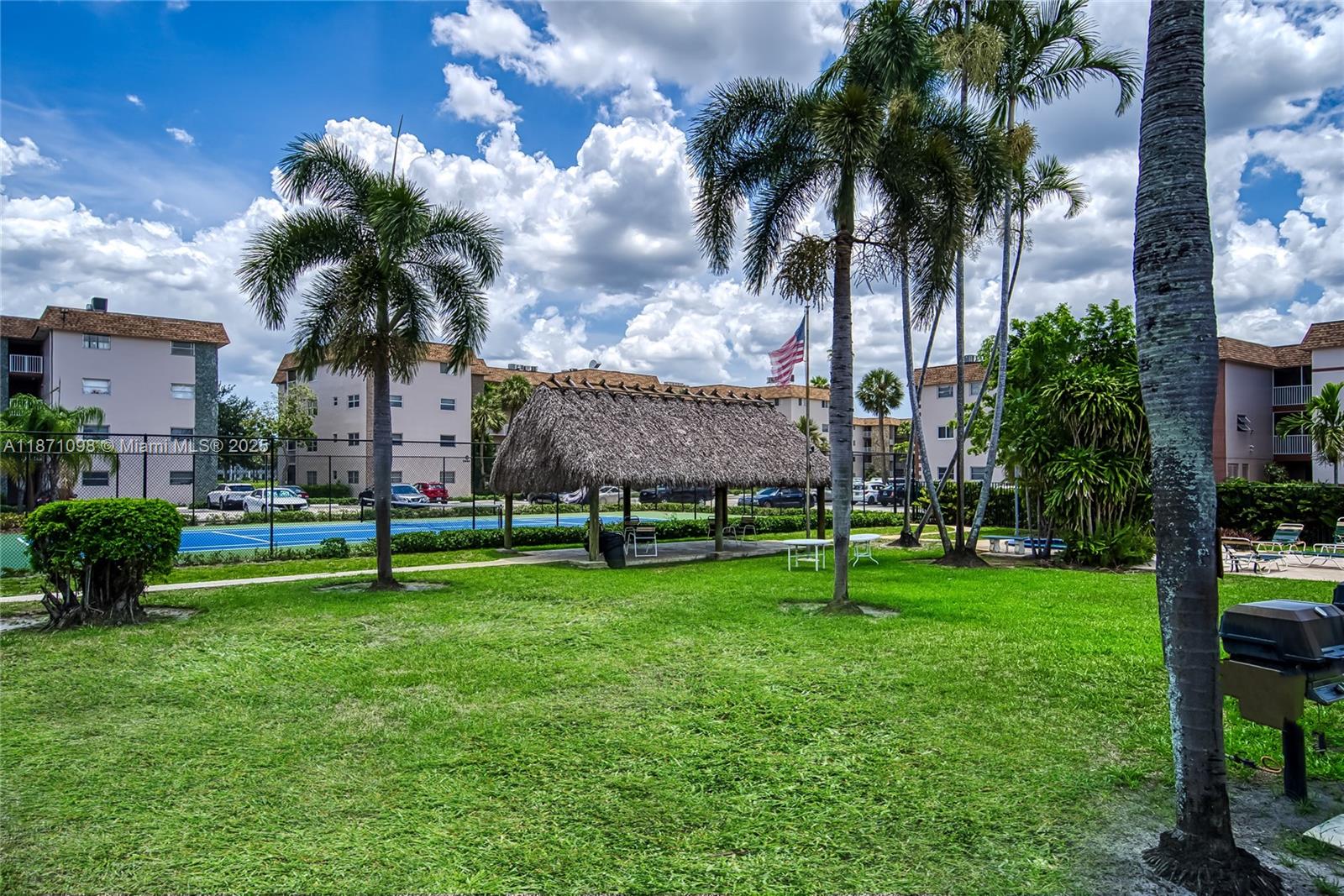 2500 Southwest 81st Avenue, Unit 402 Davie, FL 33324 - Photo 41 of 51 a view of a house with a big yard and palm trees