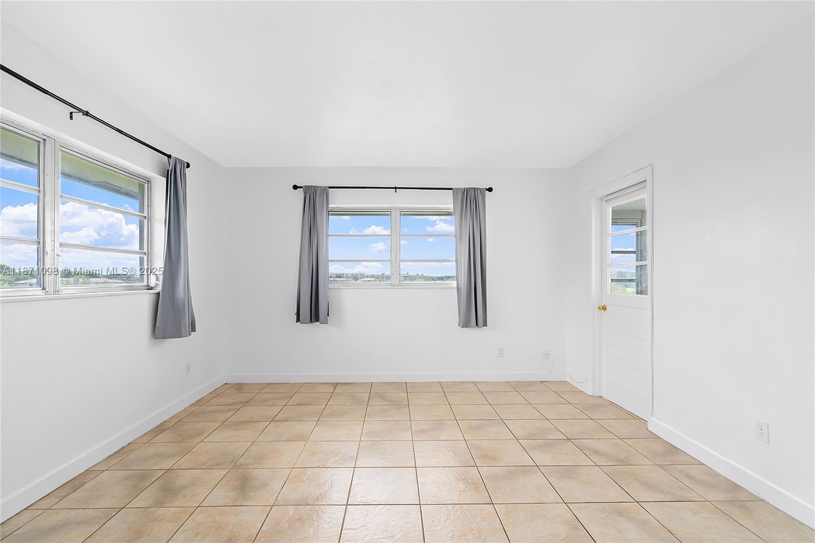 2500 Southwest 81st Avenue, Unit 402 Davie, FL 33324 - Photo 5 of 51 a view of an empty room with a window