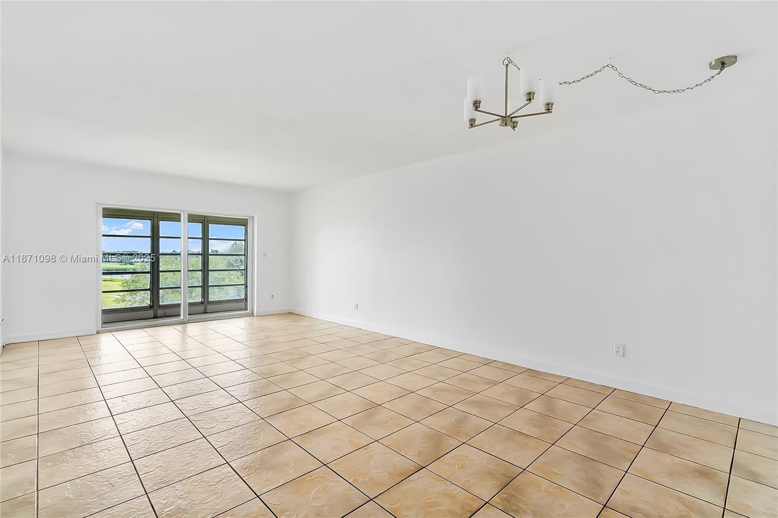 2500 Southwest 81st Avenue, Unit 402 Davie, FL 33324 - Photo 6 of 51 a view of an empty room and window