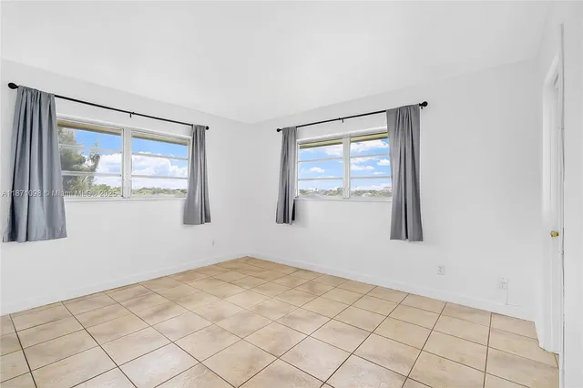 a view of an empty room and window