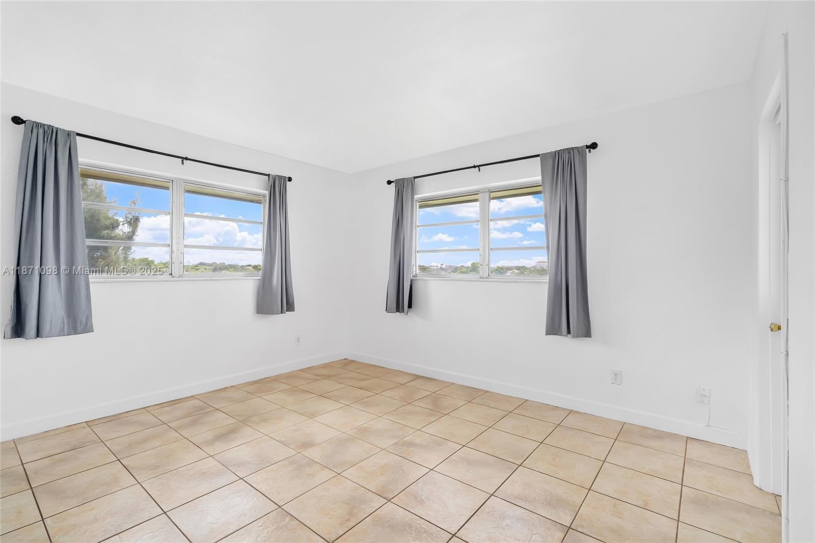 2500 Southwest 81st Avenue, Unit 402 Davie, FL 33324 - Photo 8 of 51 a view of an empty room and window