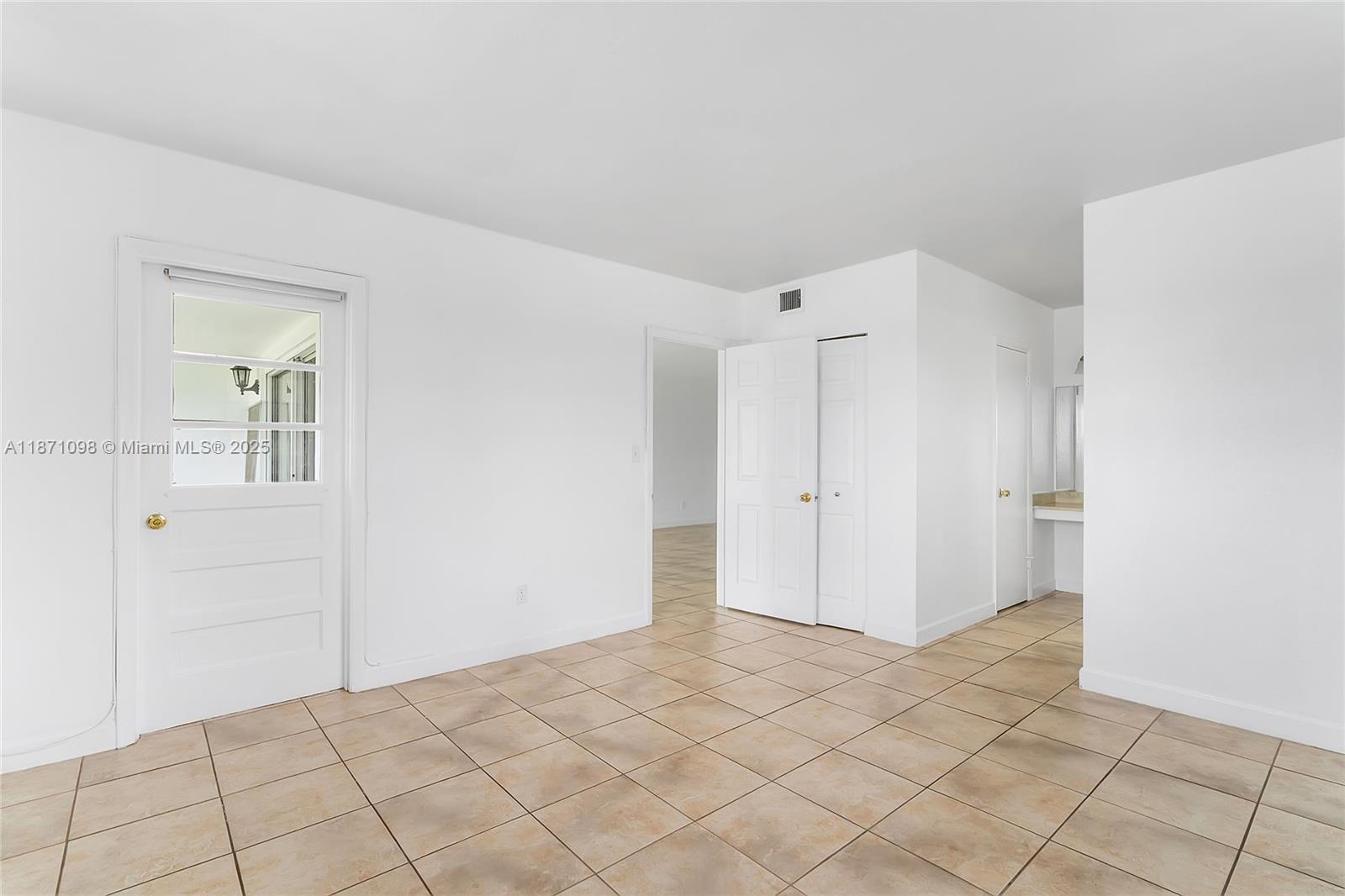 2500 Southwest 81st Avenue, Unit 402 Davie, FL 33324 - Photo 9 of 51 a view of a room with a walk in closet and wooden floor
