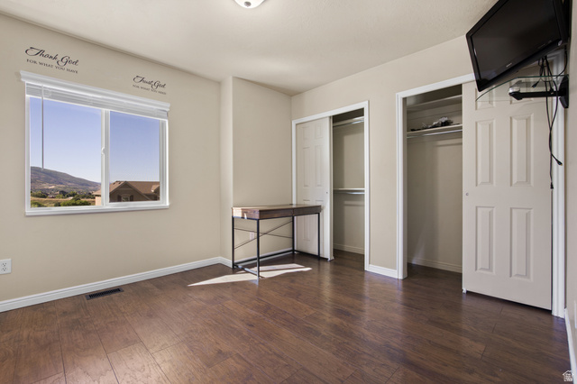 2005 Redtail Way Layton, UT 84040 - Photo 26 of 37 Spacious room featuring wood-finish flooring and two bi-fold door closets