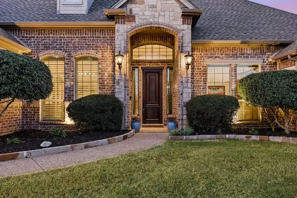 a spacious bedroom with a bed and a large window