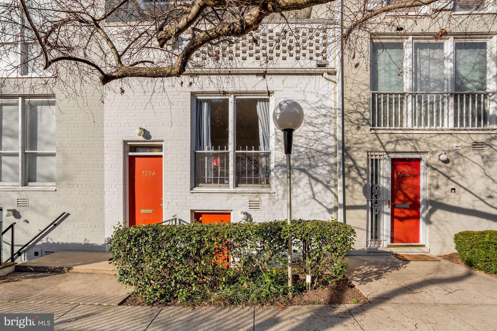 725 Delaware Avenue Southwest, Unit 218 Washington, DC 20024 - Photo 1 of 14 a front view of a house with large windows