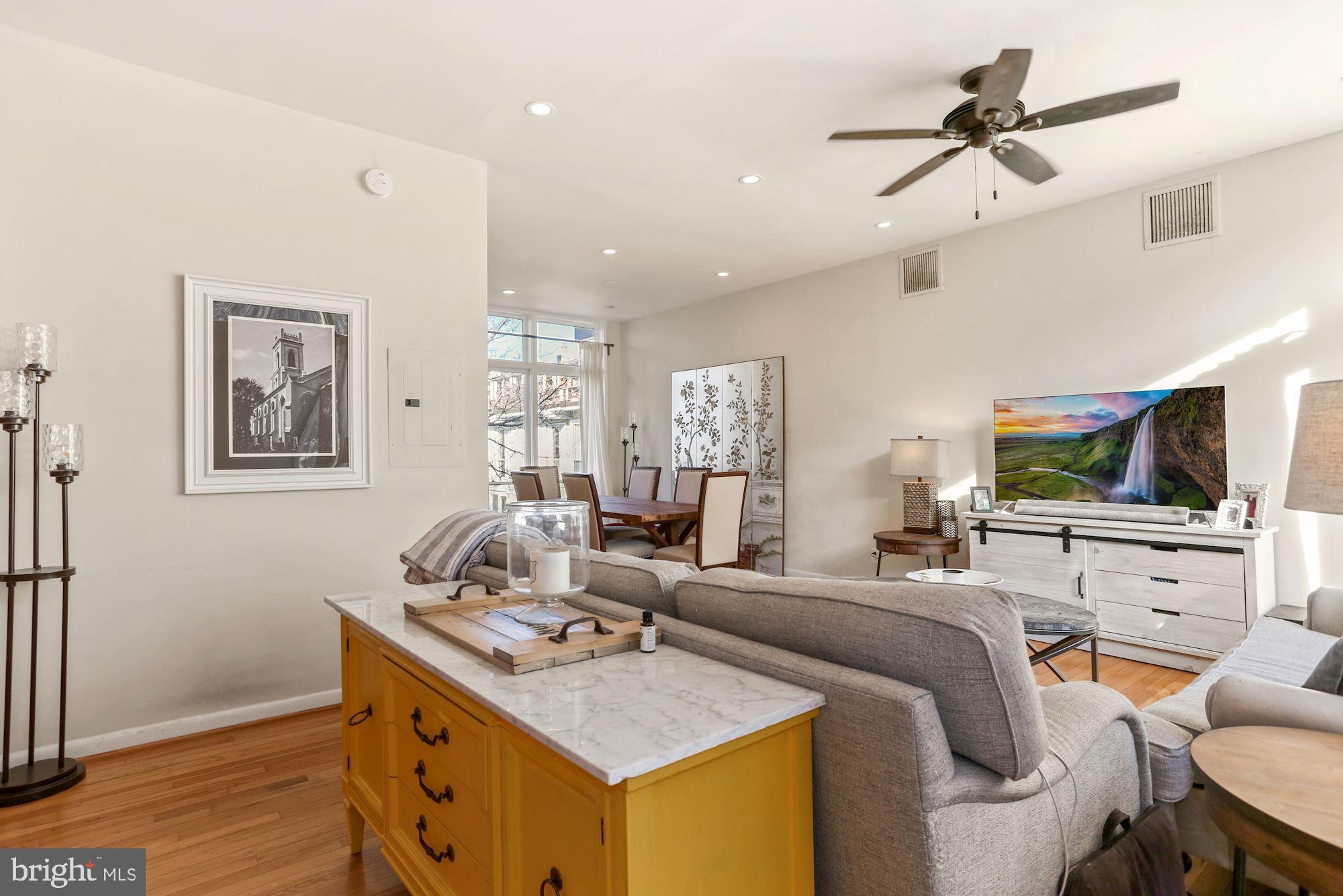 725 Delaware Avenue Southwest, Unit 218 Washington, DC 20024 - Photo 3 of 14 a living room with furniture and a flat screen tv