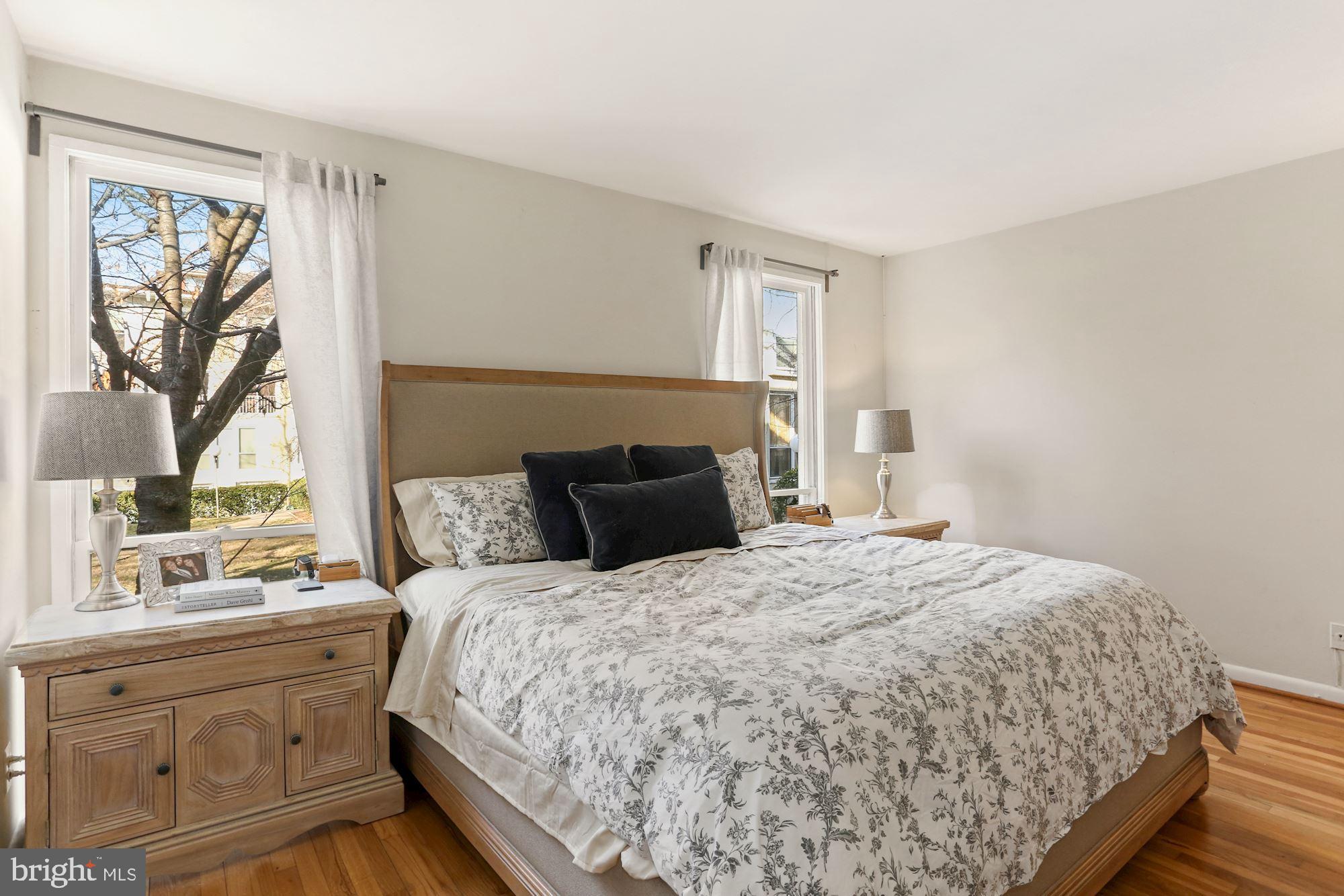 725 Delaware Avenue Southwest, Unit 218 Washington, DC 20024 - Photo 9 of 14 a bedroom with a large bed and a window