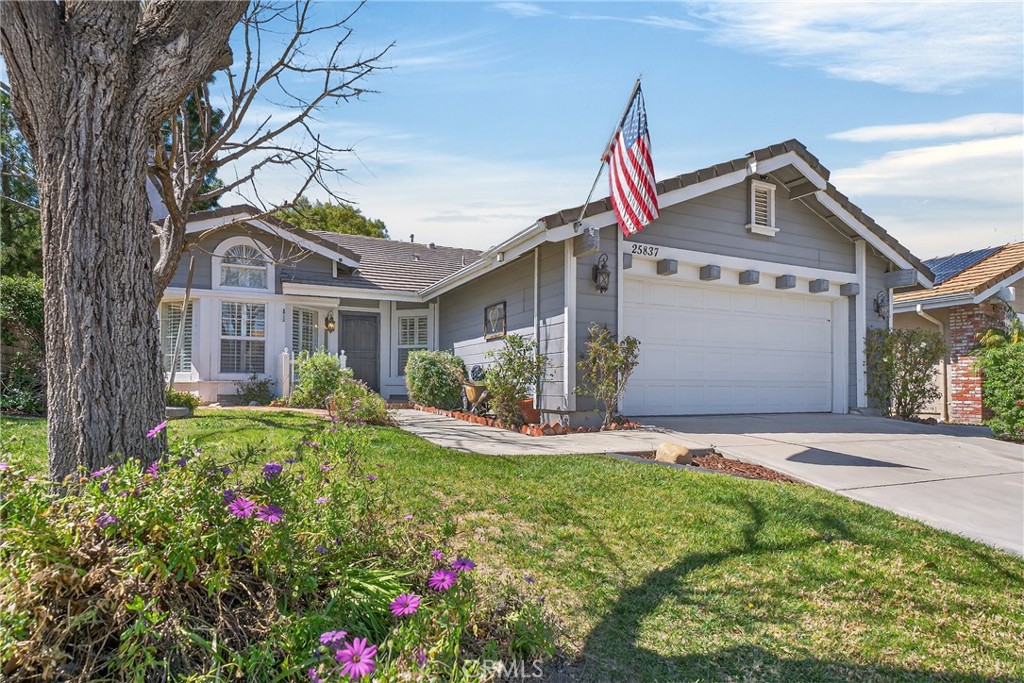 25837 Anderson Lane Stevenson Ranch, CA 91381 - Photo 1 of 22 a front view of a house with a yard and potted plants