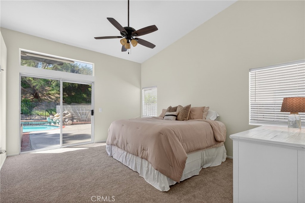 25837 Anderson Lane Stevenson Ranch, CA 91381 - Photo 14 of 22 a spacious bedroom with a bed and a large window