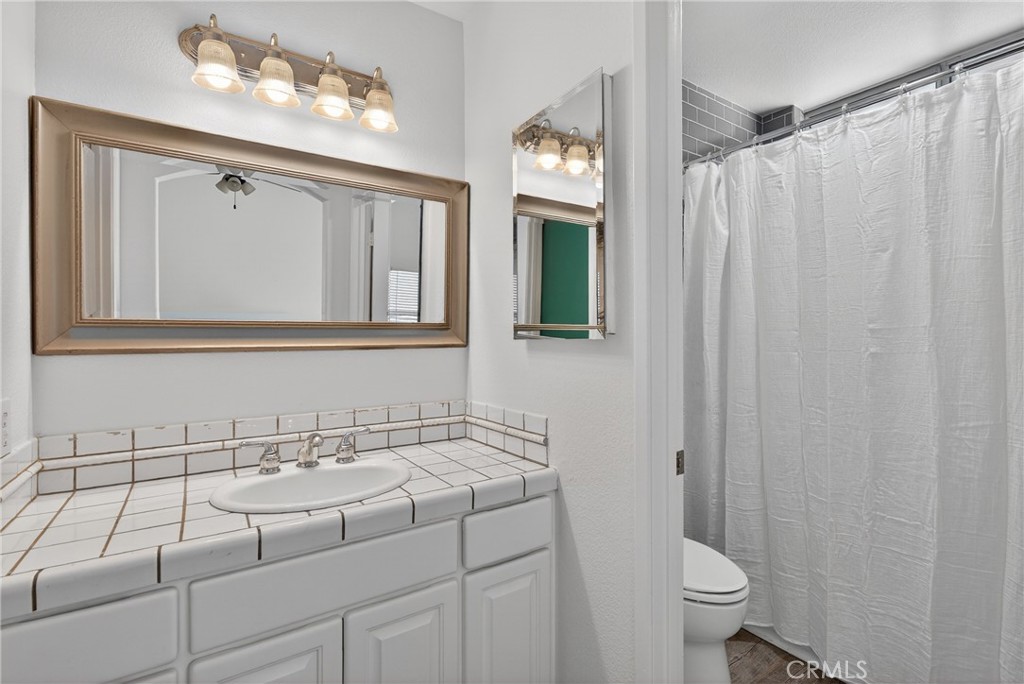 25837 Anderson Lane Stevenson Ranch, CA 91381 - Photo 15 of 22 a bathroom with a sink and a mirror