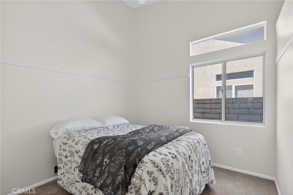 25837 Anderson Lane Stevenson Ranch, CA 91381 - Photo 16 of 22 a bedroom with a bed and a window