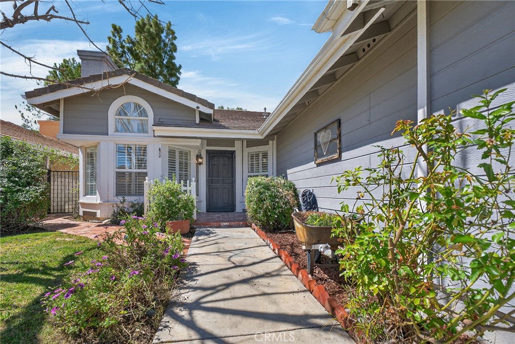 25837 Anderson Lane Stevenson Ranch, CA 91381 - Photo 2 of 22 a front view of a house with a yard
