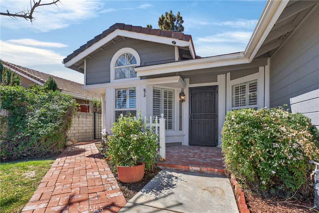 25837 Anderson Lane Stevenson Ranch, CA 91381 - Photo 3 of 22 a front view of a house with a garden