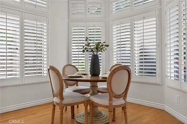 a view of a dining room with furniture and window