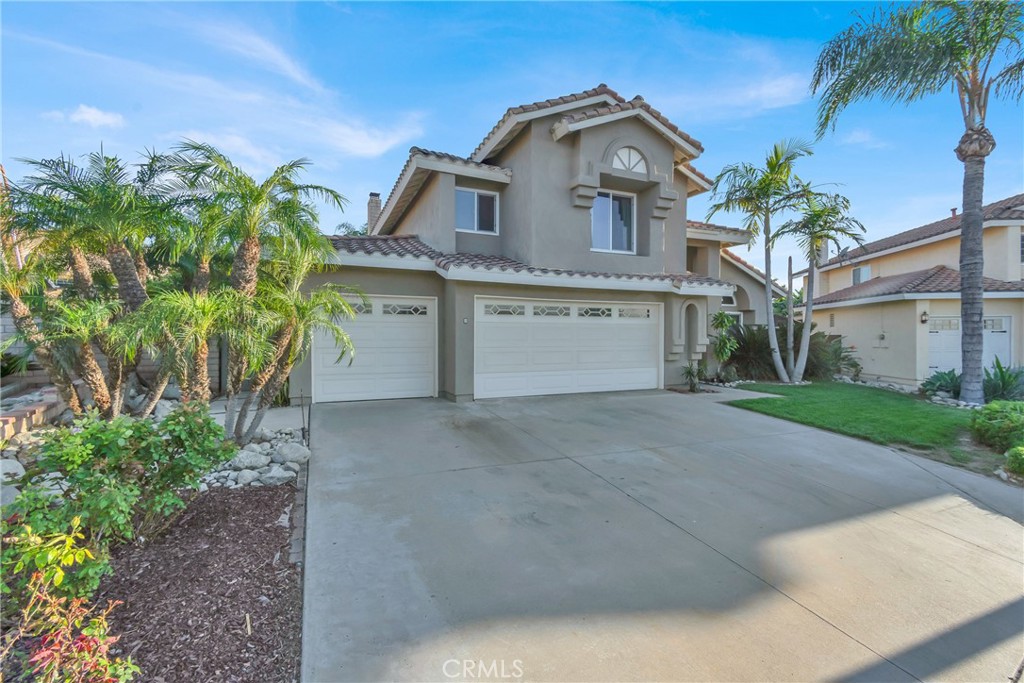 3350 May Court Riverside, CA 92503 - Photo 2 of 55 a front view of a house with a yard and garage