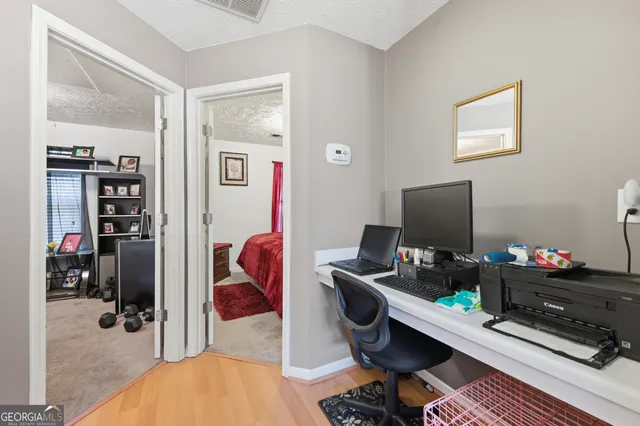 a bed room with a bed and a chair