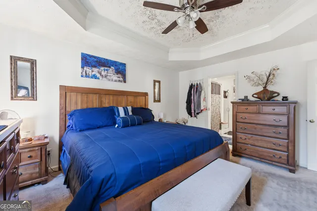 a bathroom with a sink mirror and vanity