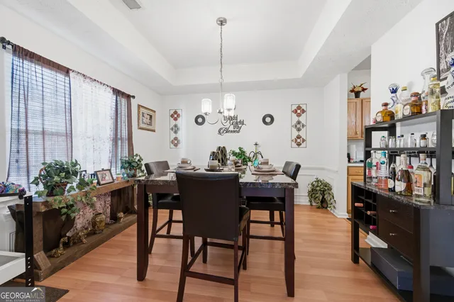 a view of a dining room with furniture window and wooden floor
