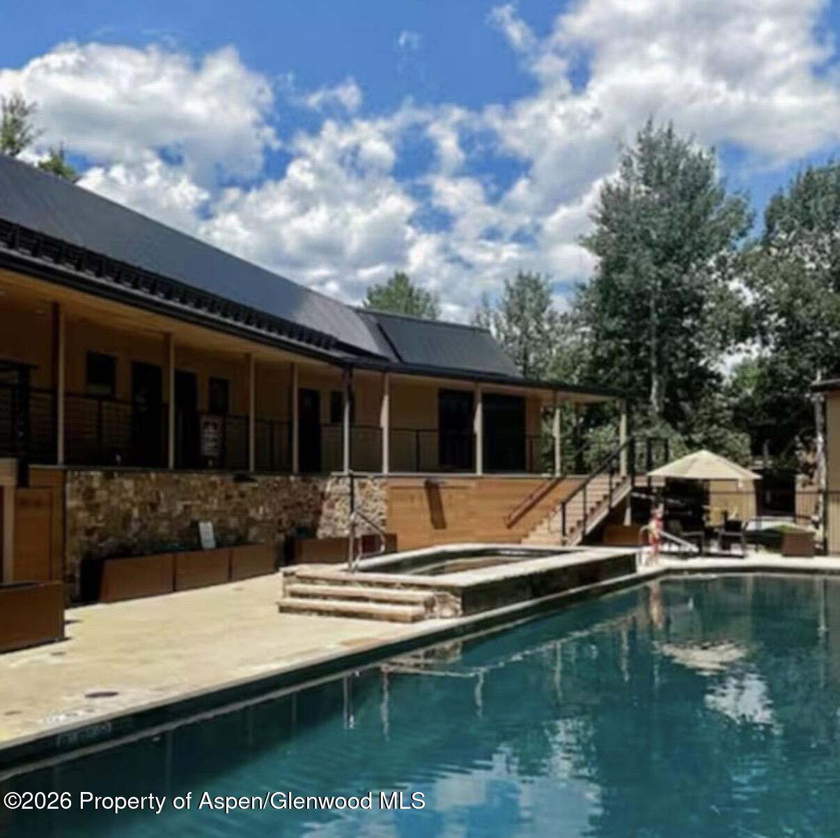 35 Upper Woodbridge Road, Unit 3 Snowmass Village, CO 81615 - Photo 12 of 16 a view of pool with outdoor seating