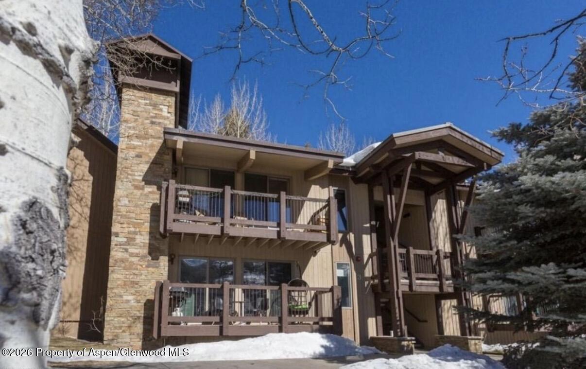 35 Upper Woodbridge Road, Unit 3 Snowmass Village, CO 81615 - Photo 10 of 16 a view of a house with a street