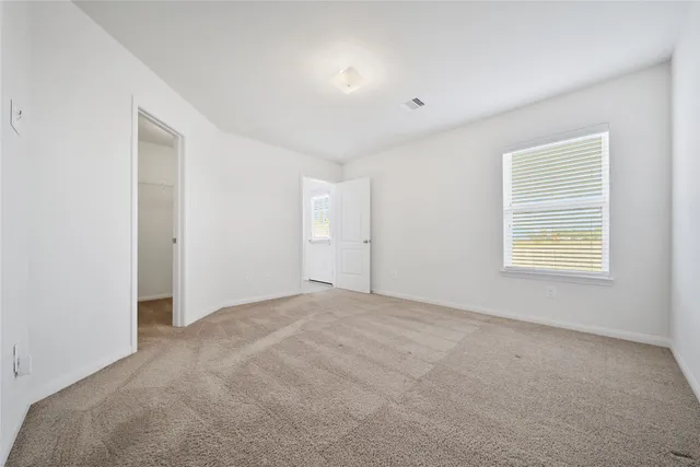 a bathroom with a granite countertop sink mirror and a bathtub