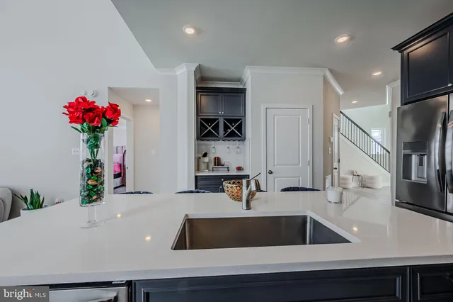 a view of living room with furniture and flowers