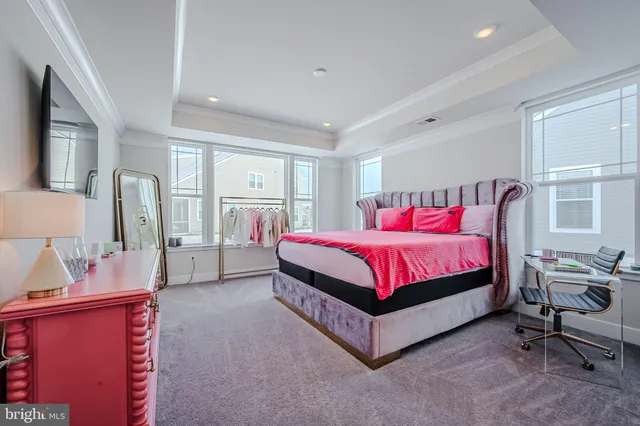 a bed room with a bed and a chair