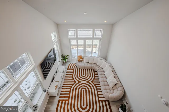 a view of walk in closet with window and couch