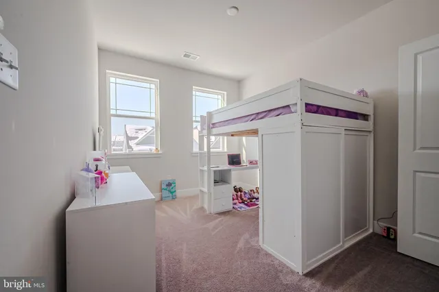 a very nice looking bedroom with a big bed and a window