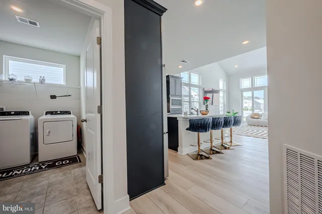 a view of a kitchen and dining room