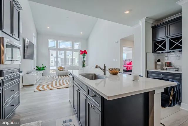 a view of kitchen island a sink and living room