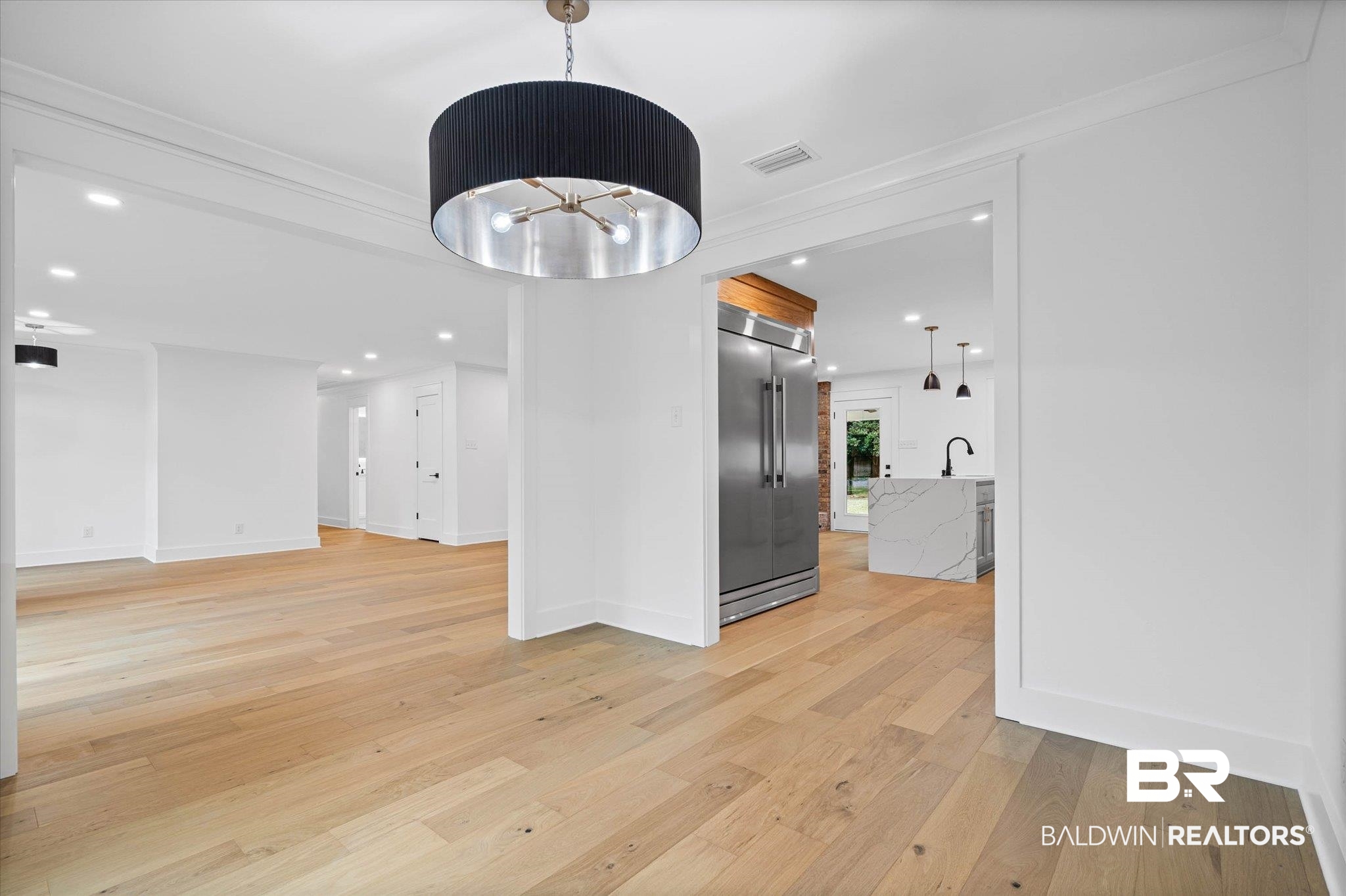 11 Schwaemmle Drive Mobile, AL 36608 - Photo 11 of 32 Unfurnished dining area featuring light wood finished floors and suspended lighting