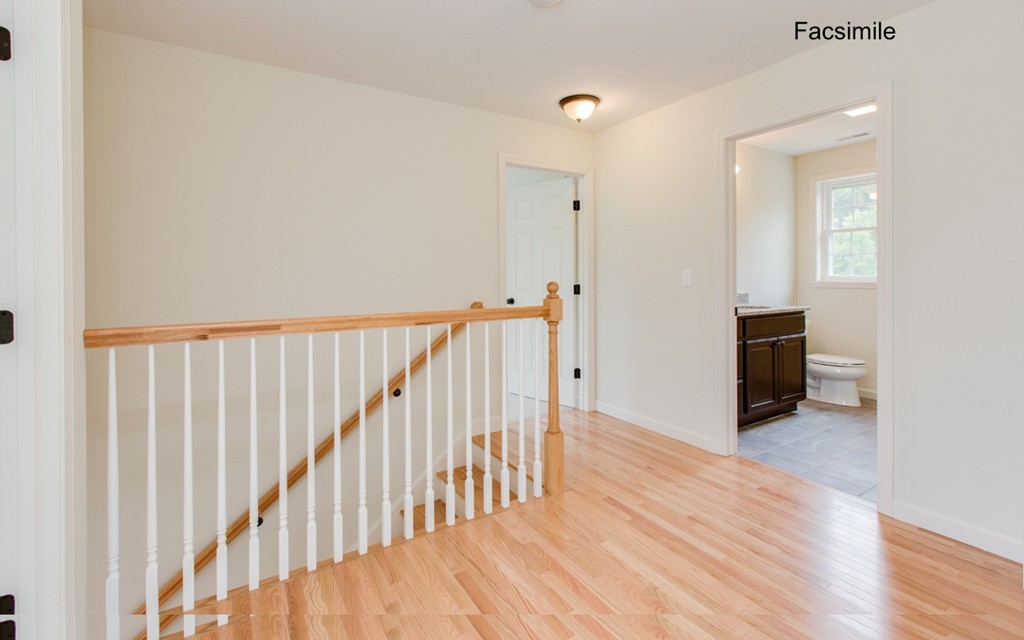 Lot 2-55-4 Old County Road Pelham, NH 03076 - Photo 11 of 16 a view of a hallway with wooden floor and stairs