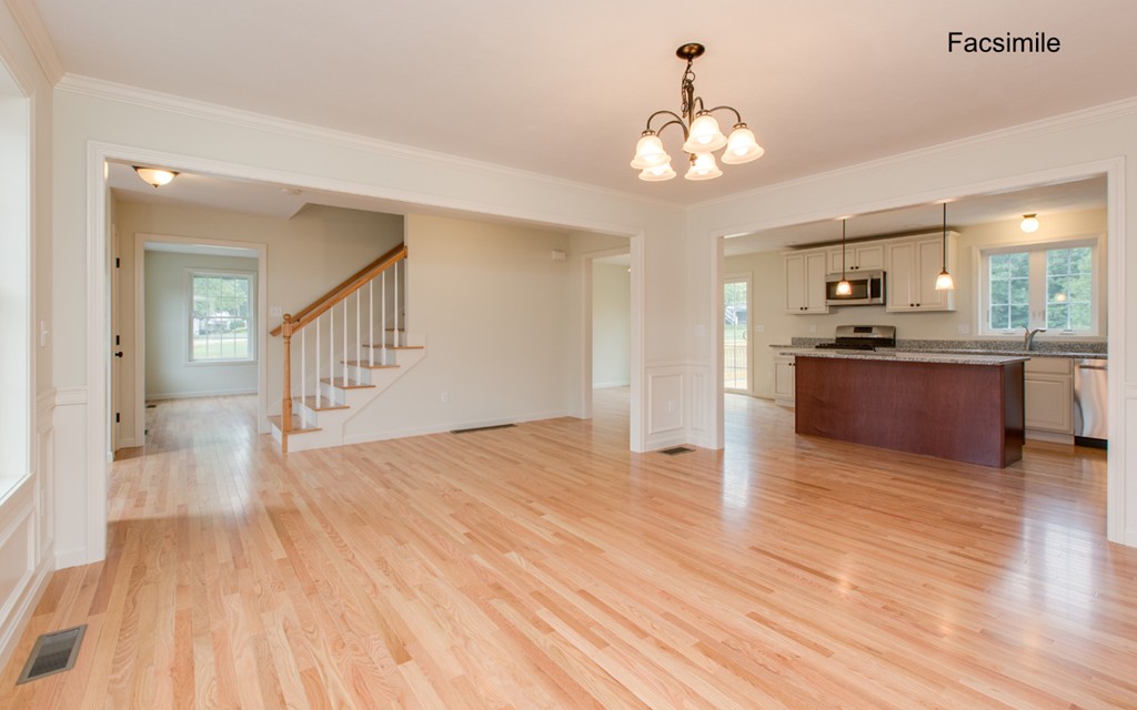 Lot 2-55-4 Old County Road Pelham, NH 03076 - Photo 6 of 16 a view of a hallway with wooden floor and a kitchen