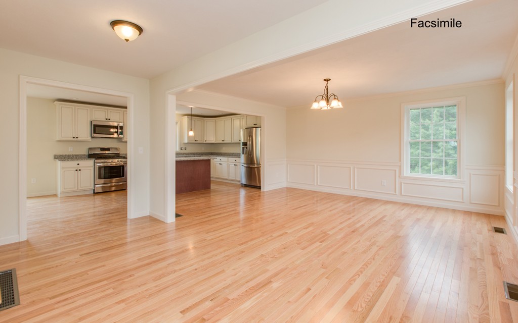 Lot 2-55-4 Old County Road Pelham, NH 03076 - Photo 8 of 16 an empty room with wooden floor and kitchen view