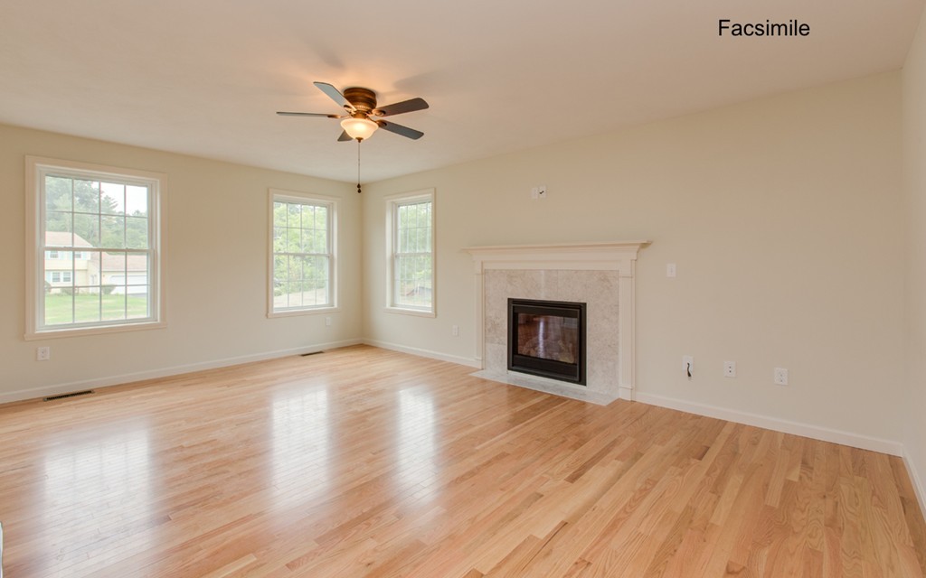 Lot 2-55-4 Old County Road Pelham, NH 03076 - Photo 9 of 16 an empty room with windows and fireplace
