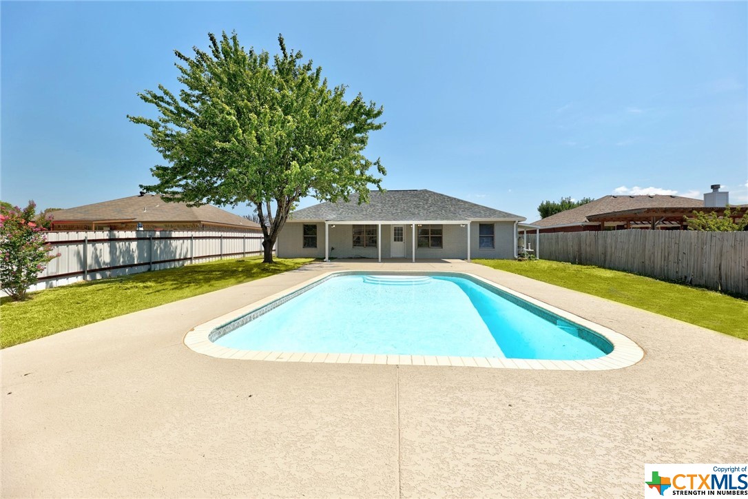 a view of a house with swimming pool