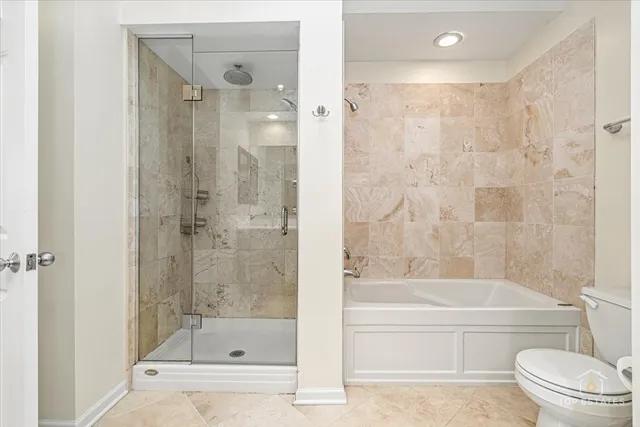 a bedroom with a bed chandelier and a window