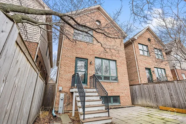 a front view of a house with large windows